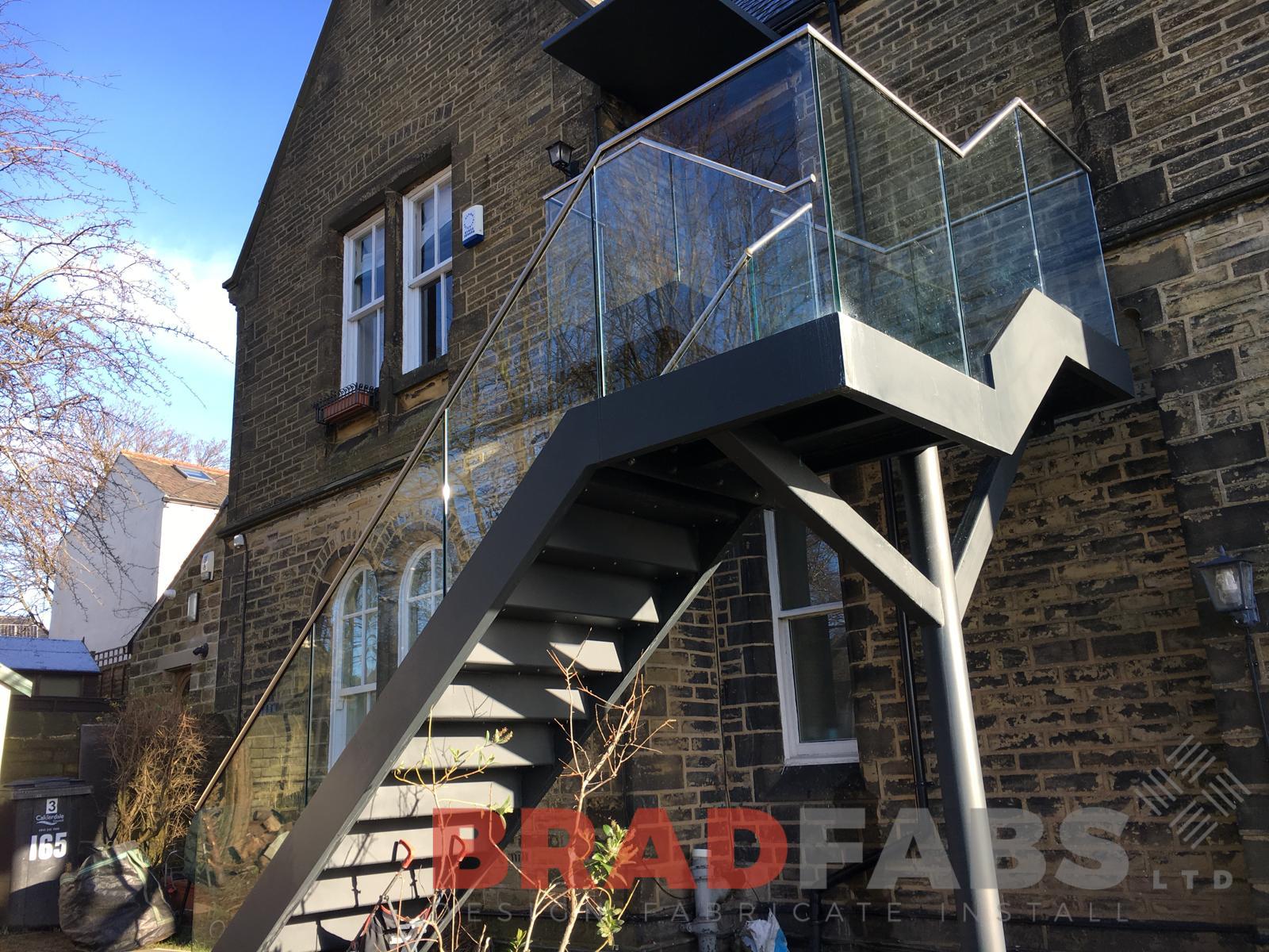 bespoke straight external staircase with infinity glass balustrade and stainless steel handrail, complete with composite decked flooring by Bradfabs Ltd 