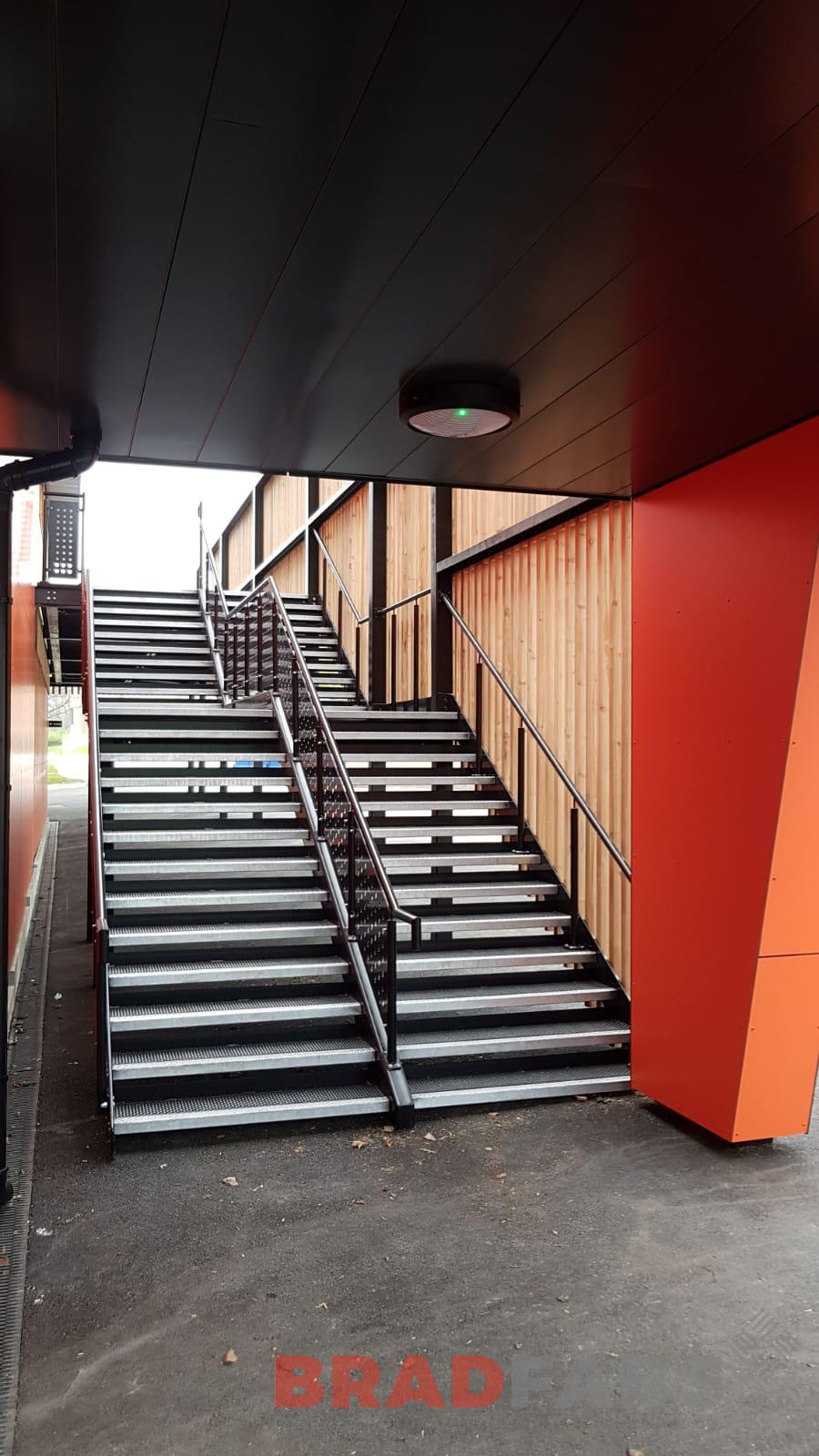 Straight staircase manufactured in mild steel, galvanised, powder coated, decorative balustrade and octopus flooring planks by Bradfabs 