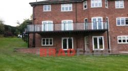 Unique and large powder coated balcony and spiral staircase by bradfabs